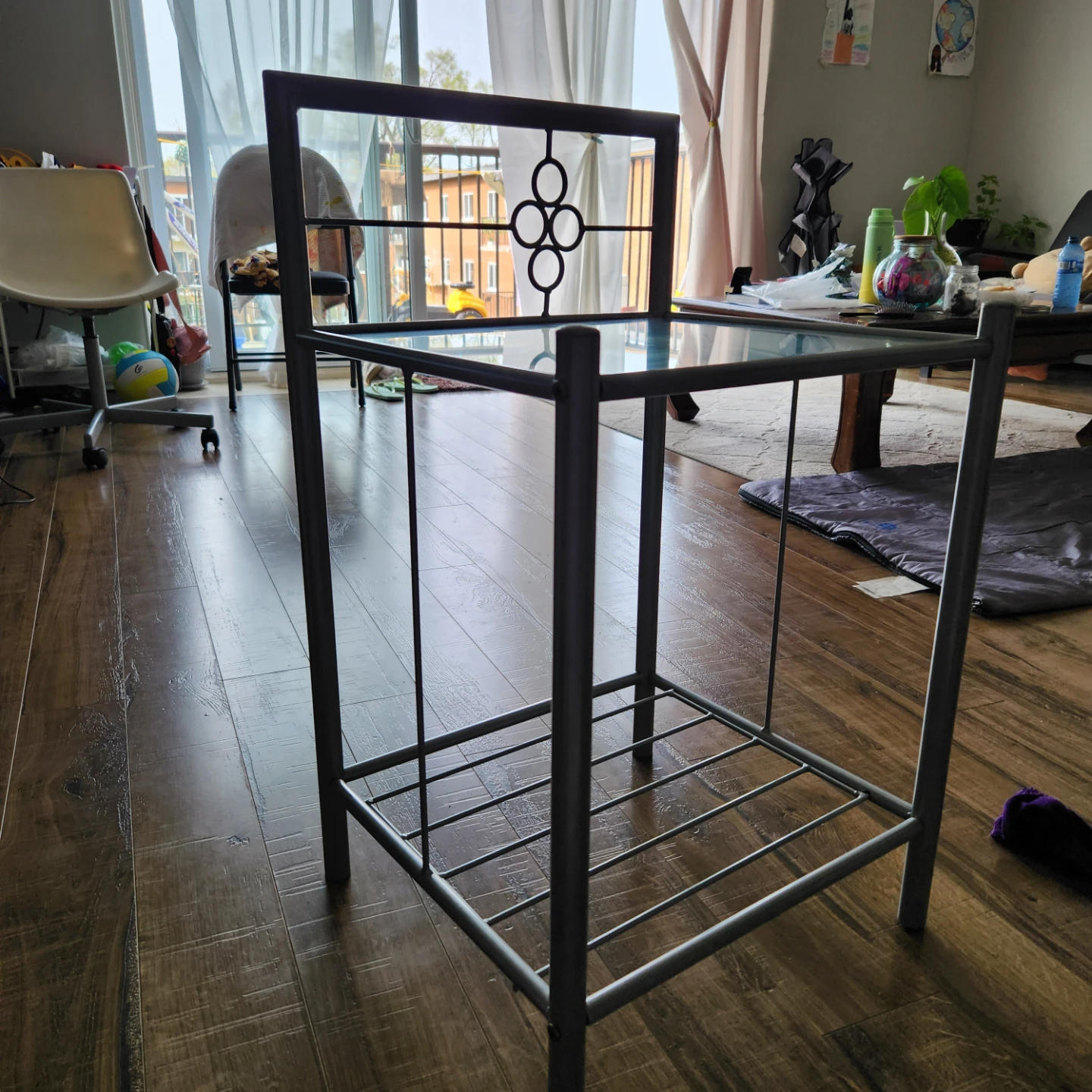 Glass top side table with metal frame
