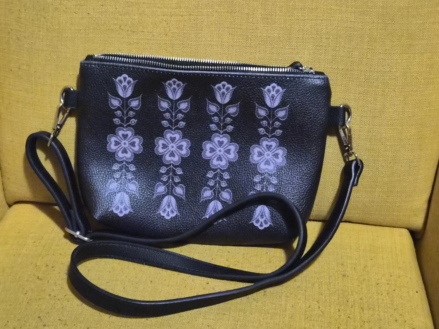 Womens Black crossbody bag with floral pattern