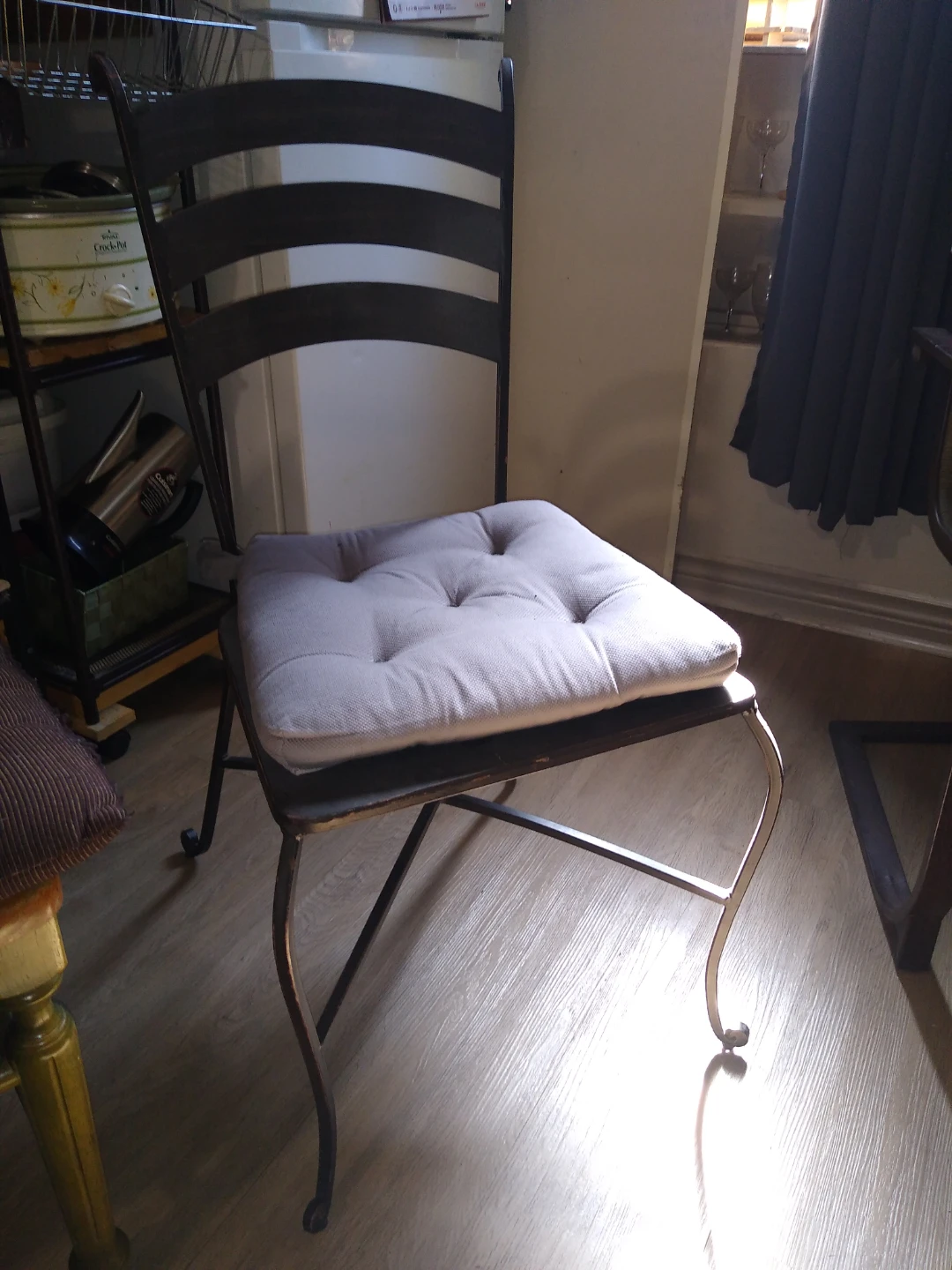 Wrought iron chair with cushion