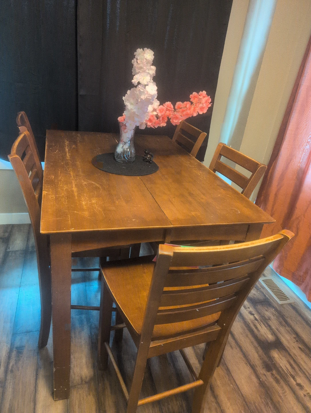 Bar height table with six chairs and a leaf