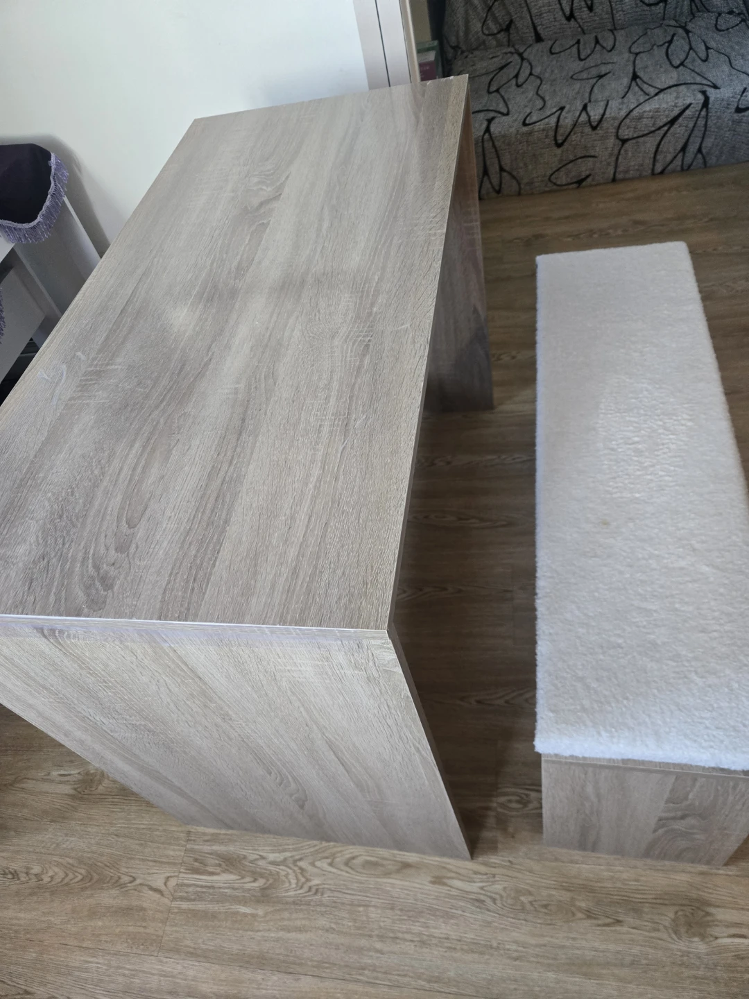 Wood grain dining table with white bench