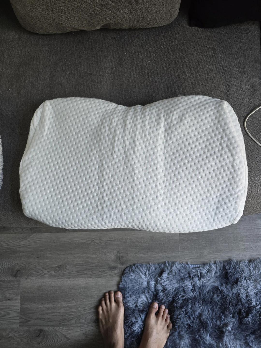 White Cervical Pillow and Assorted Hangers