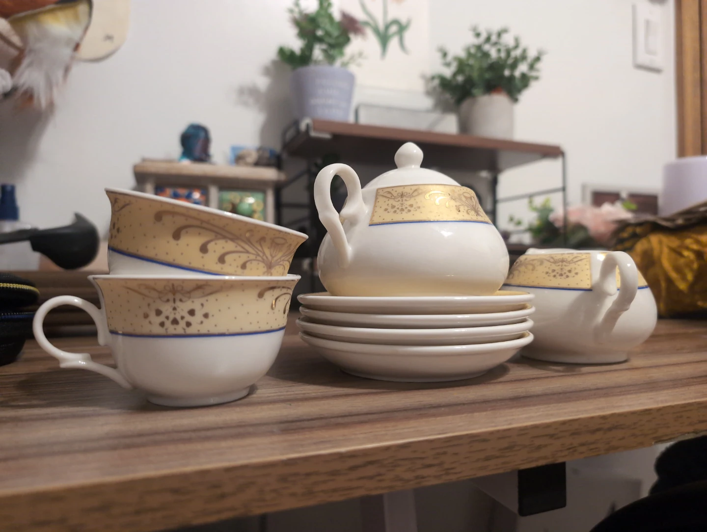 White and Gold Tea Set with Teacups and Saucers