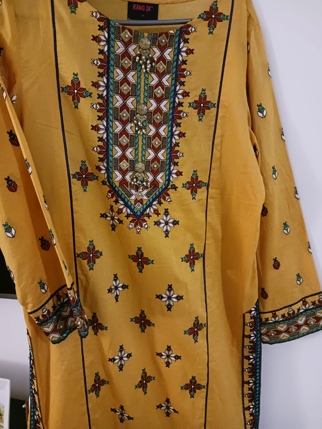 Rang Ja Yellow Embroidered Kurti occasionally one time used