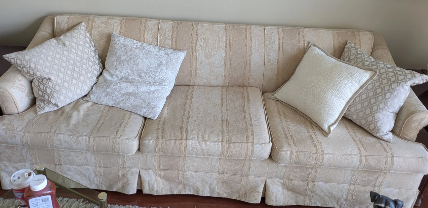 Cream Damask Sofa with Accent Pillows