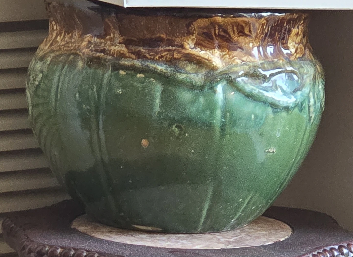 Green and brown ceramic pot