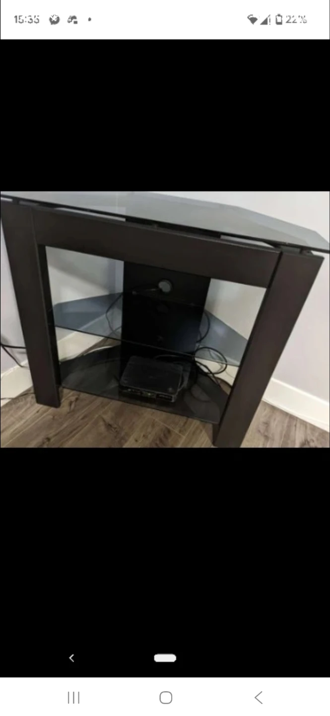 Black corner TV stand with glass shelves