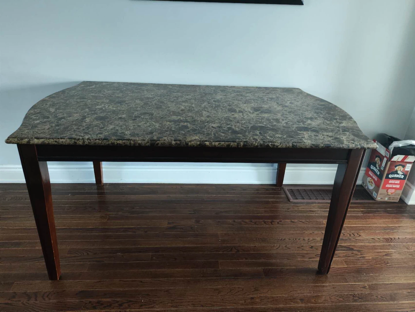 Marble top dining table with dark wood base