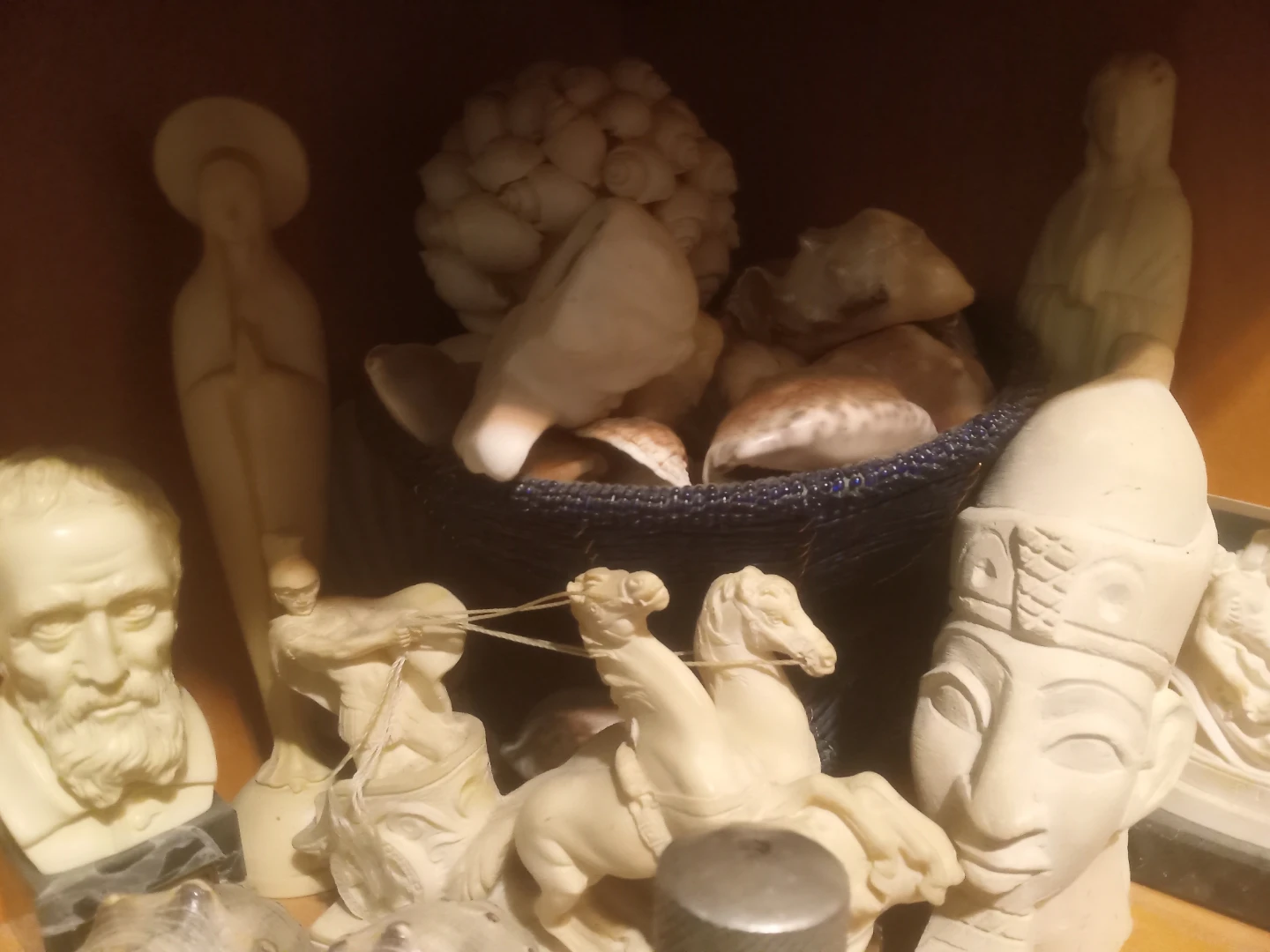 Collection of decorative figurines and shells
