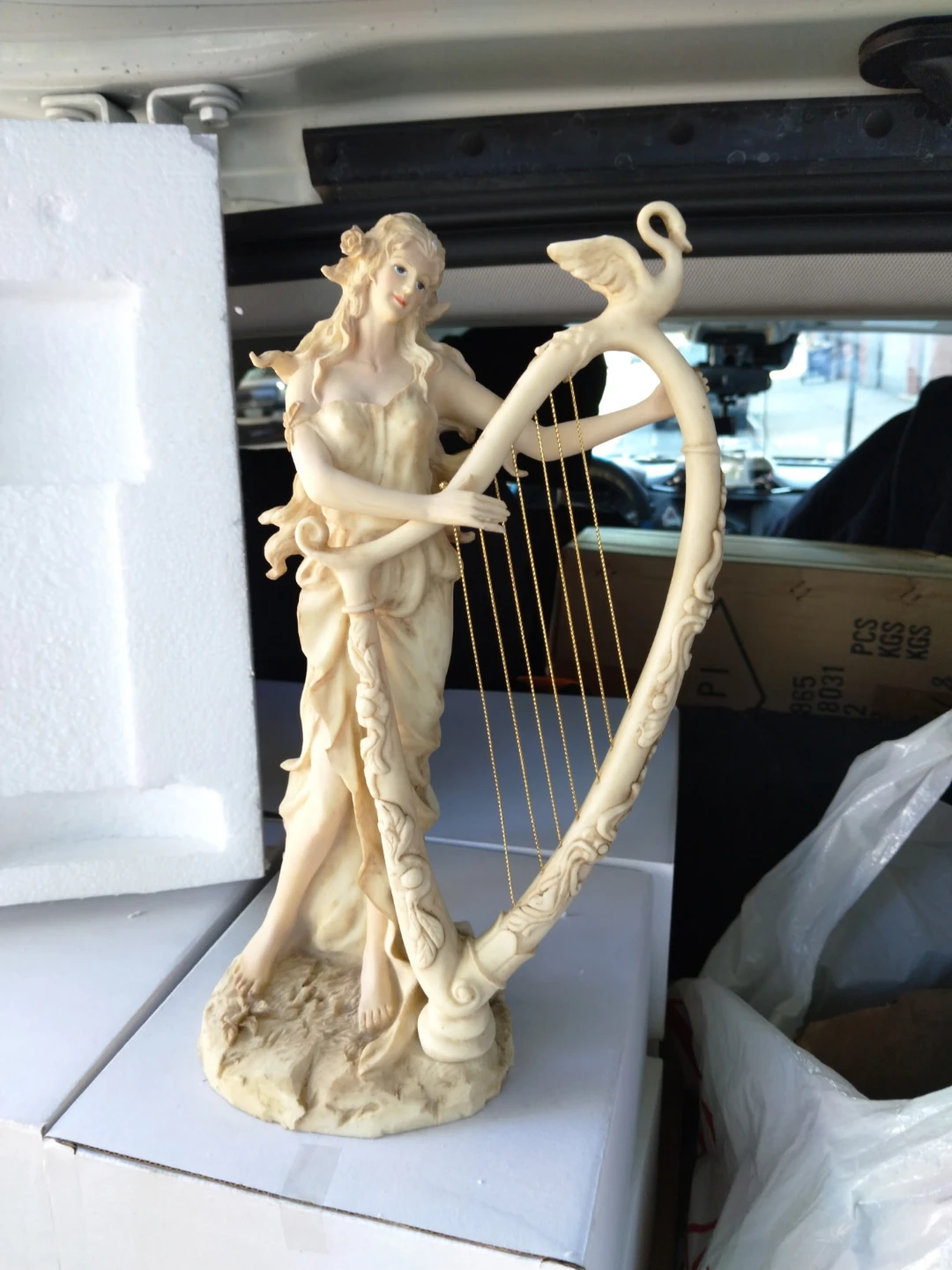 Figurine of a Woman with a Harp and Swan