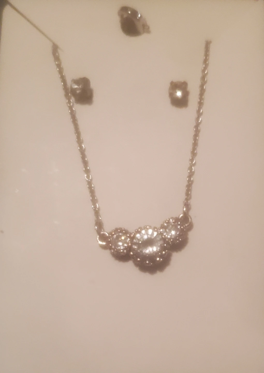 Silver tone necklace and earring set with clear crystals