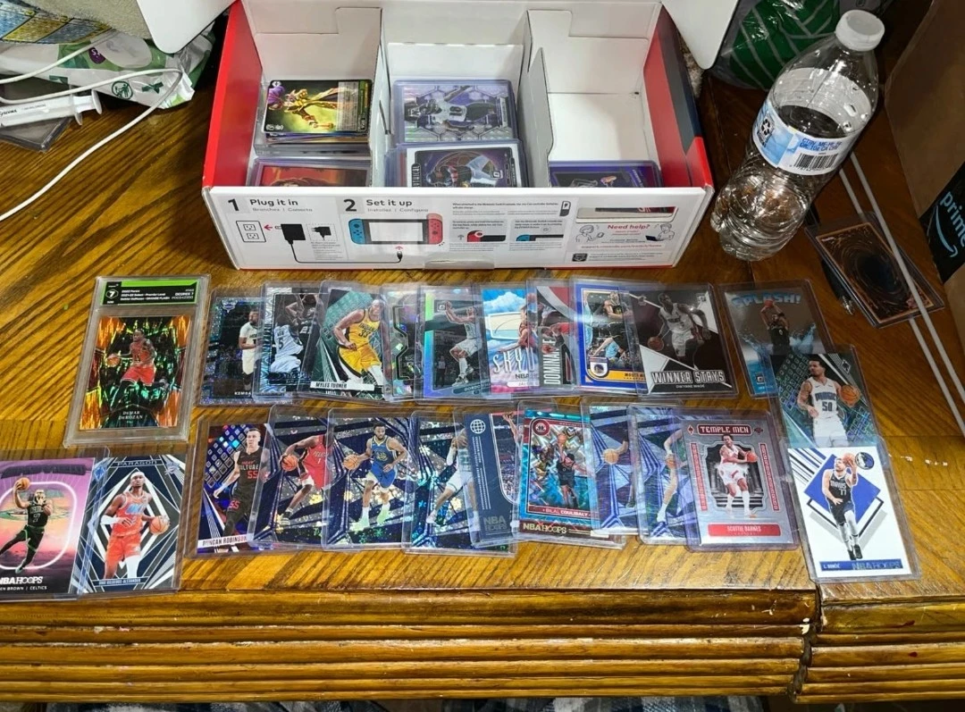 Collection of basketball and football tcg 125 cards