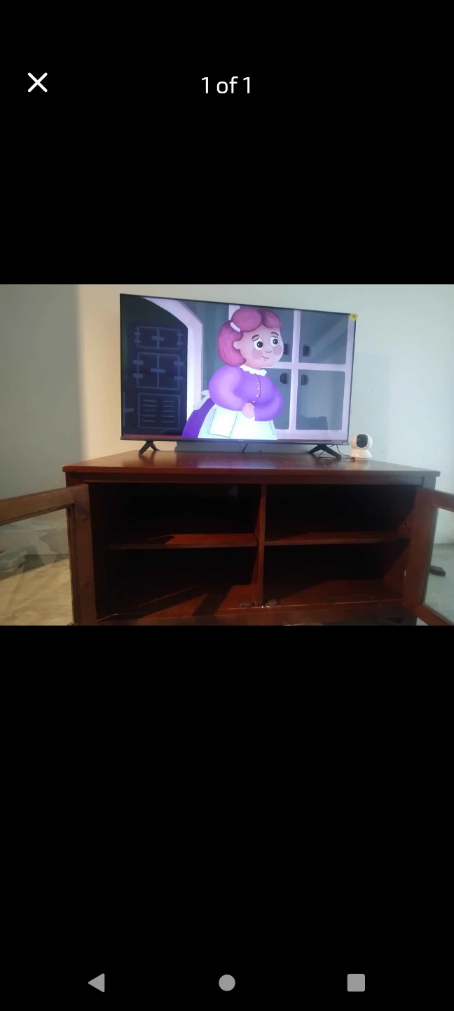 Hisense Google TV with wooden TV cabinet