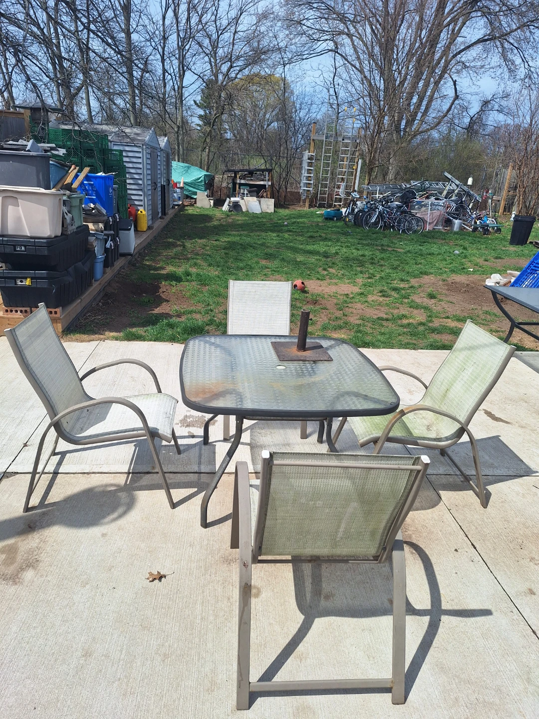 Glass patio table with 4 chairs