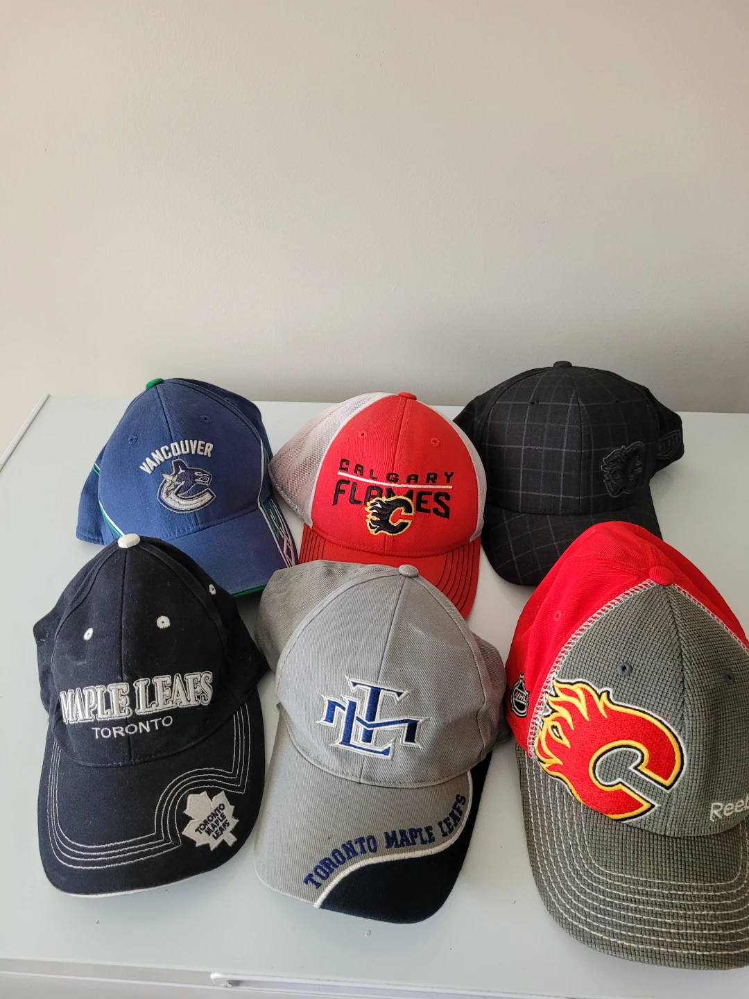 Calgary Flames & Toronto Maple Leafs Hockey Caps $10 each