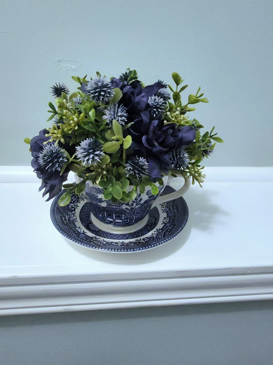 Artificial Flower Arrangement in Teacup and Saucer
