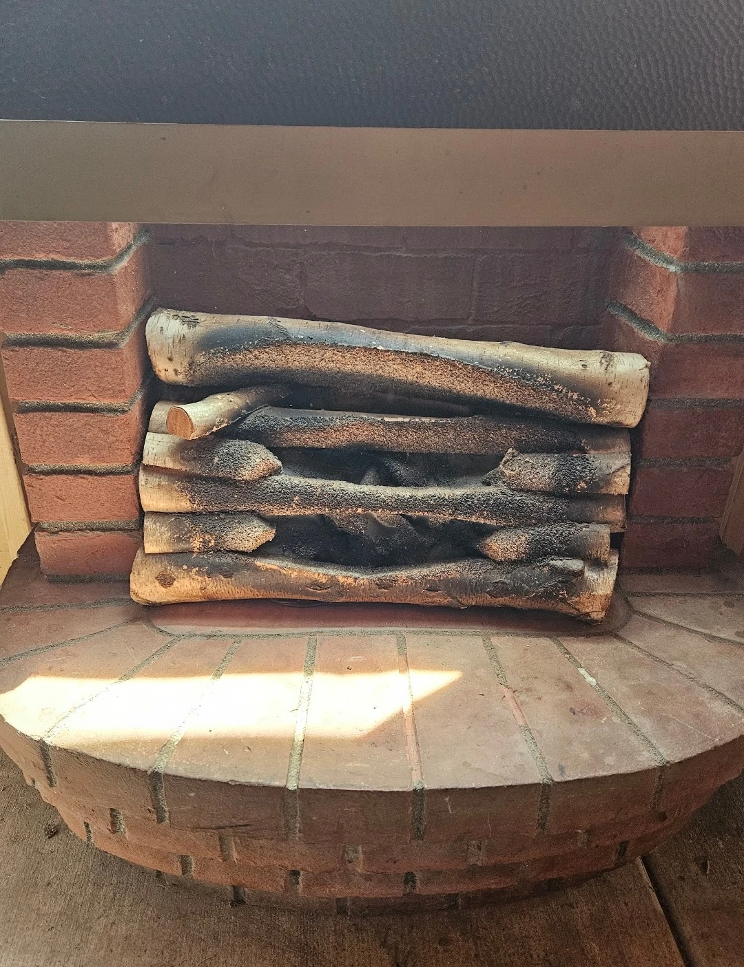 Vintage Brick Fireplace with Black Hood and Faux Logs - photo 2