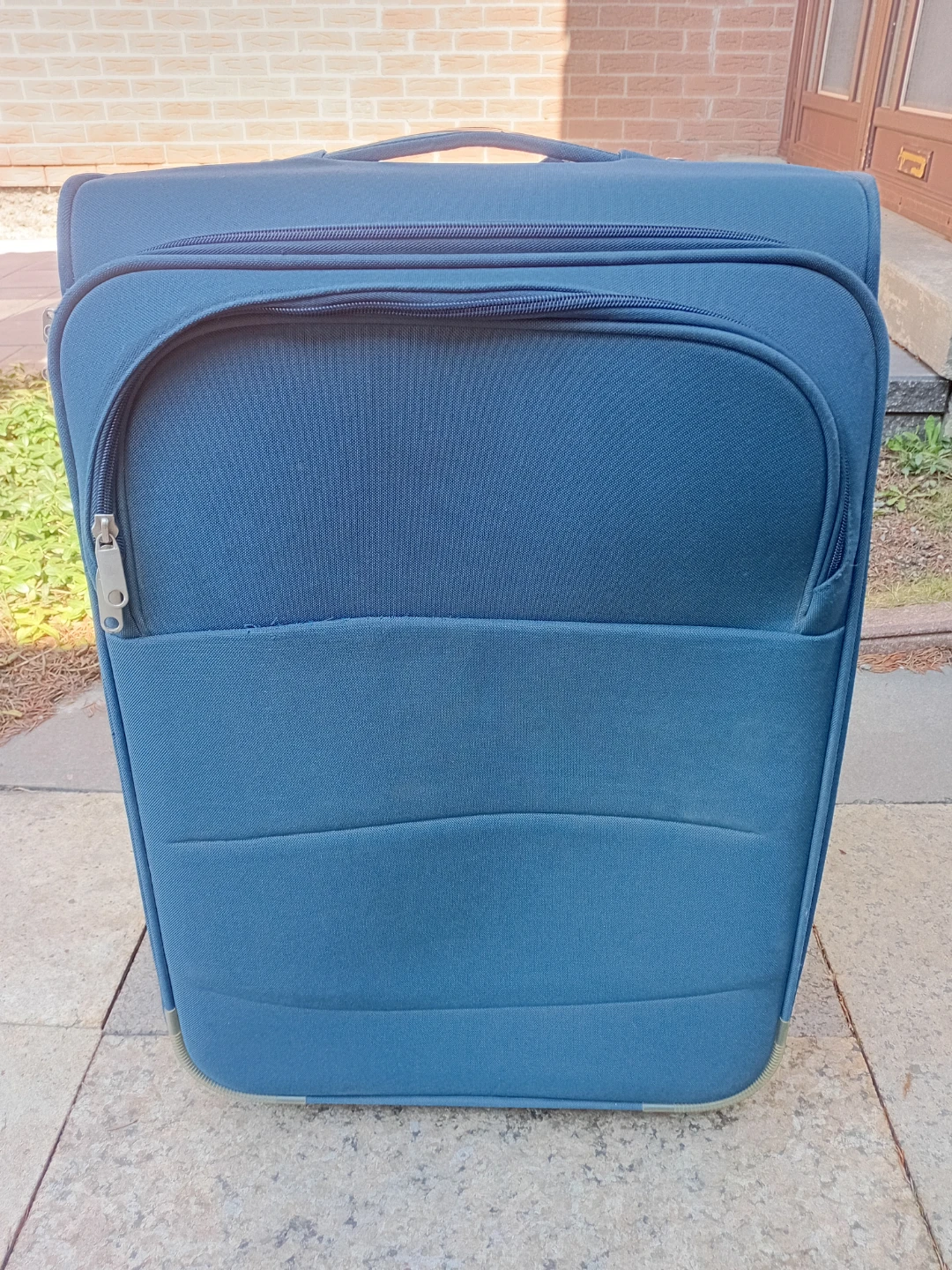 Blue soft-shell rolling suitcase - photo 3
