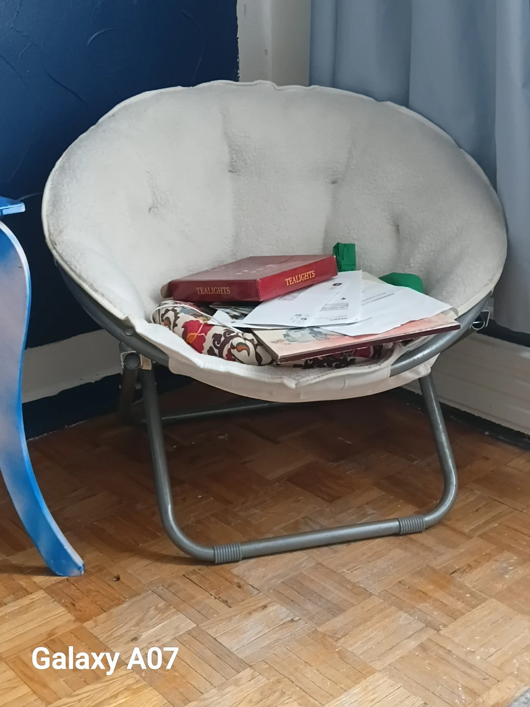 Cozy saucer chair with fluffy cushion