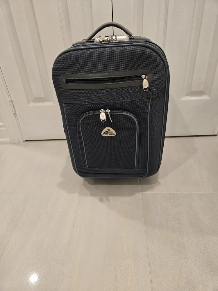 Travelpro Blue Rolling Suitcase