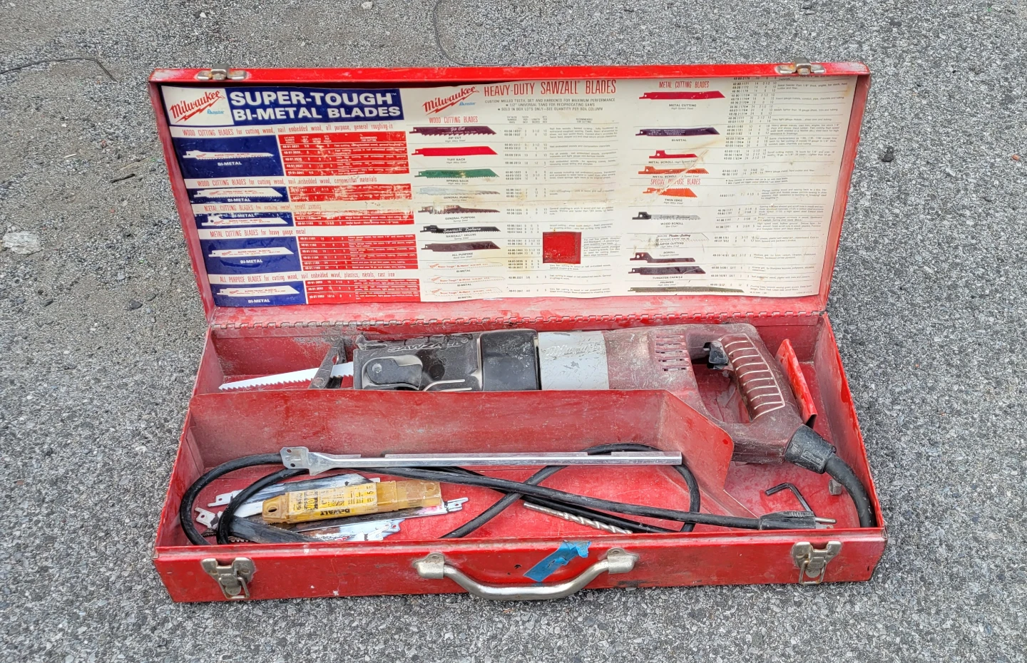 Milwaukee Super-Tough corded Sawzall with blades