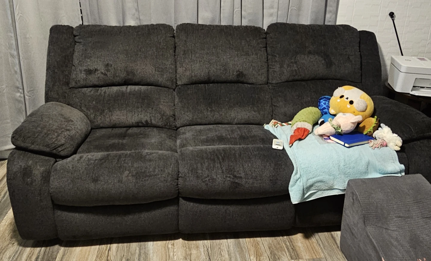 Grayish blue reclining sofa and love seat