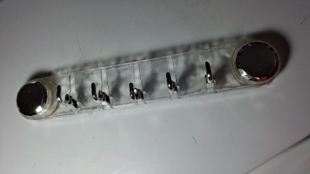 Five plastic hooks with two suction pads