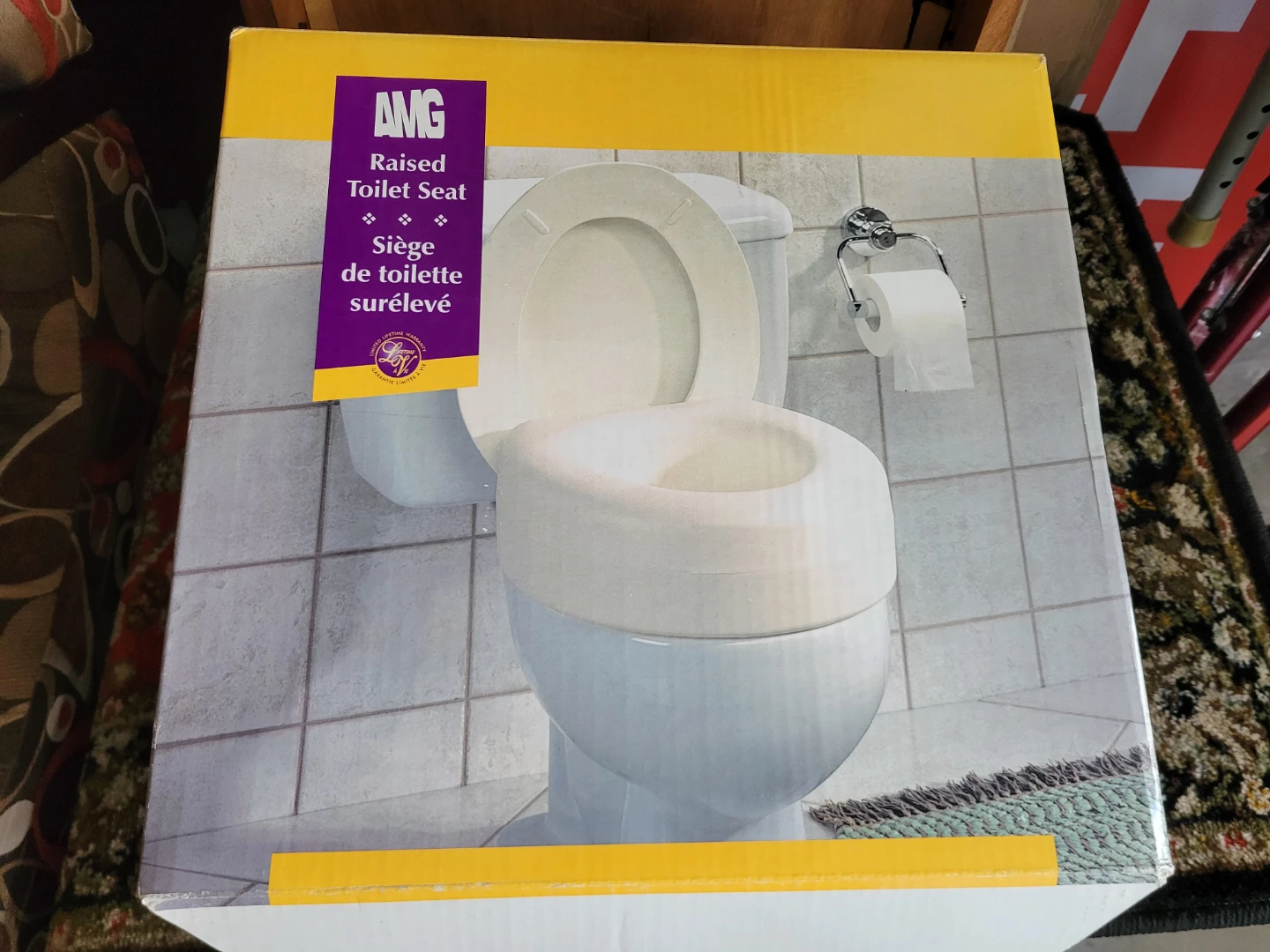 AMG Raised Toilet Seat in Like New Condition.