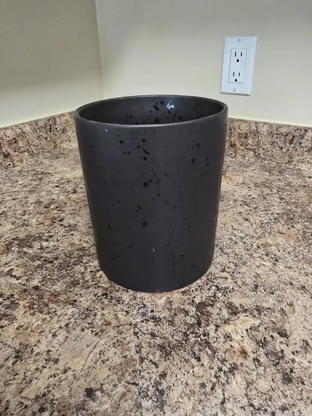 Black speckled ceramic kitchen utensil holder