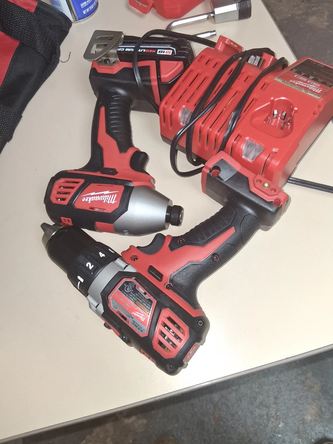 Milwaukee M18/M12 Cordless Drill and Impact Driver Combo Kit - photo 2