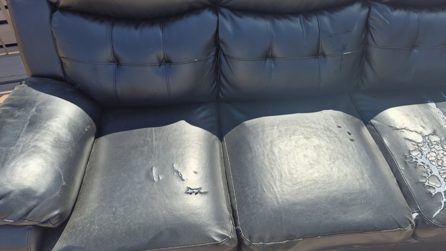 Black faux leather sofa