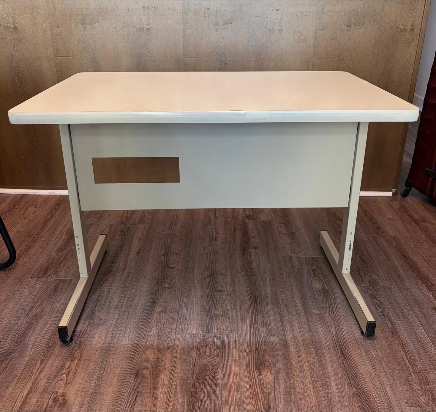 Sturdy table with wooden top and metal body