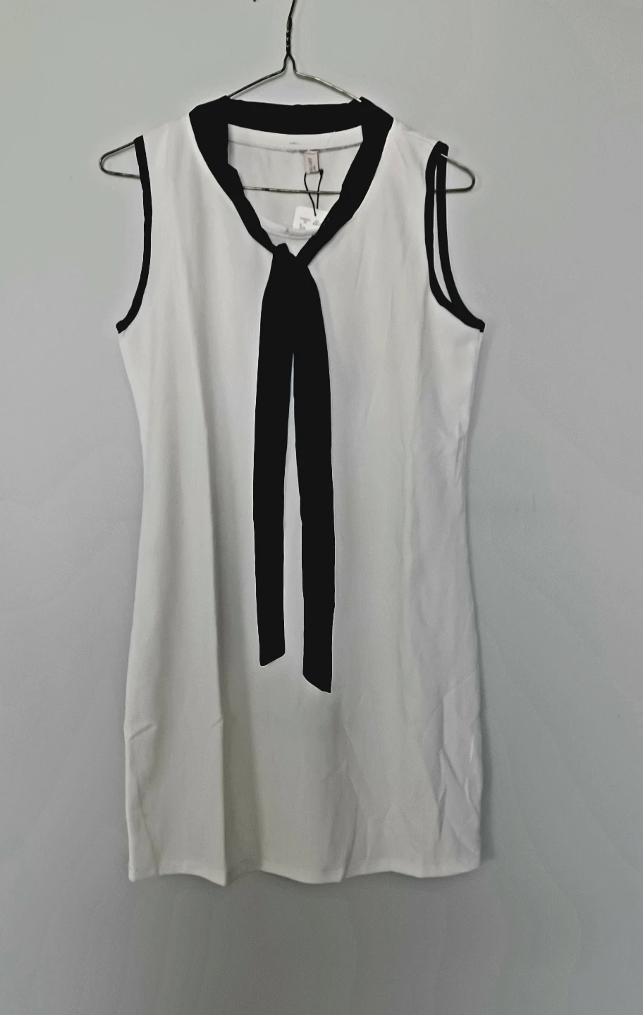 White Sleeveless Dress with Black Bow Detail