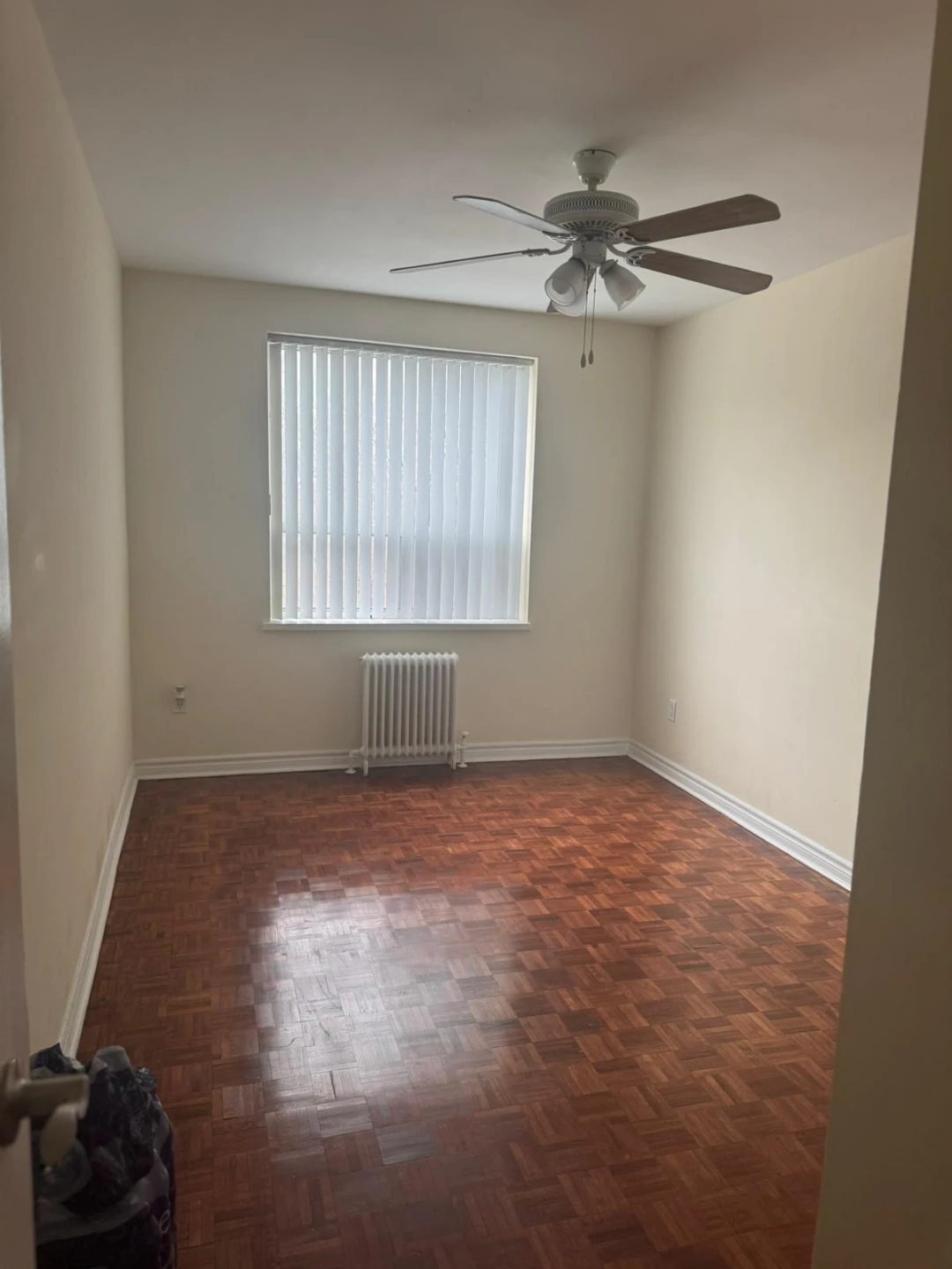Large Room with parquet flooring and ceiling fan