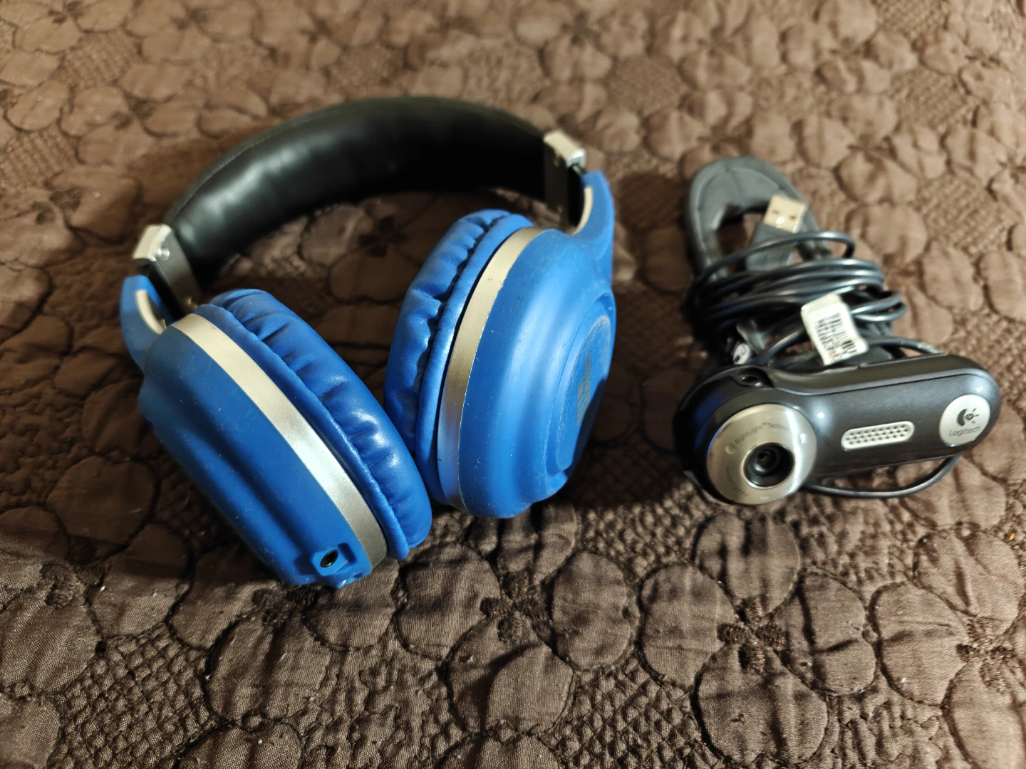 Logitech Webcam and Blue Headphones