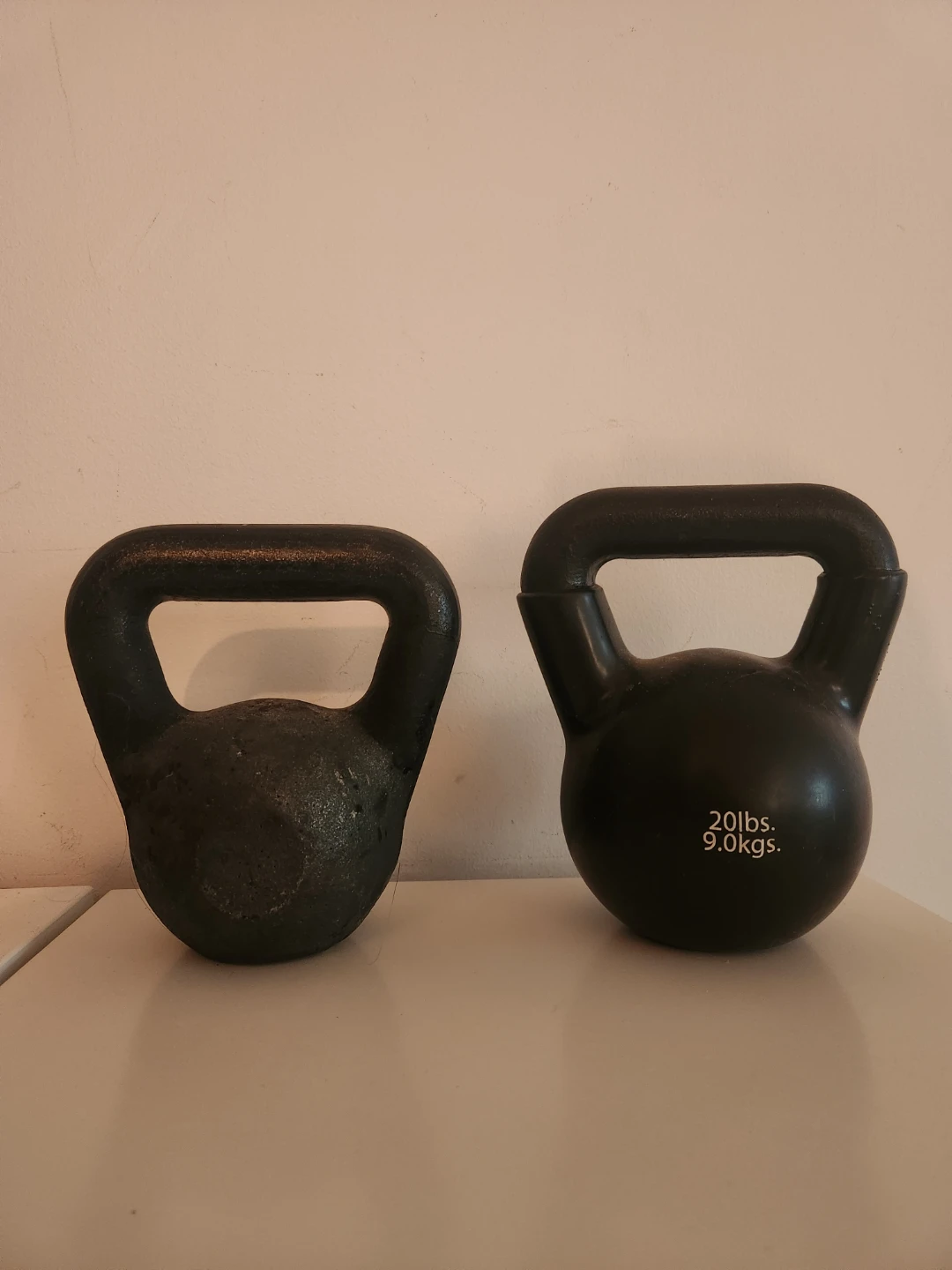 2 cast iron kettlebells 15lbs and 20lbs