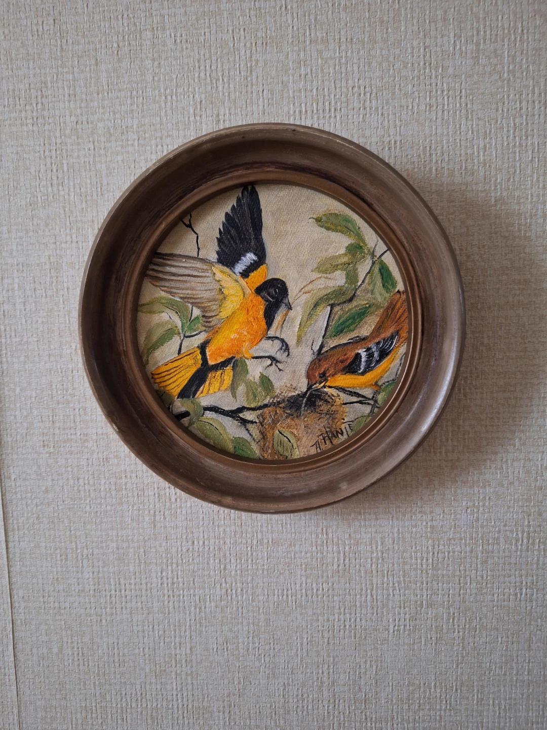 Framed handmade painting of birds.
