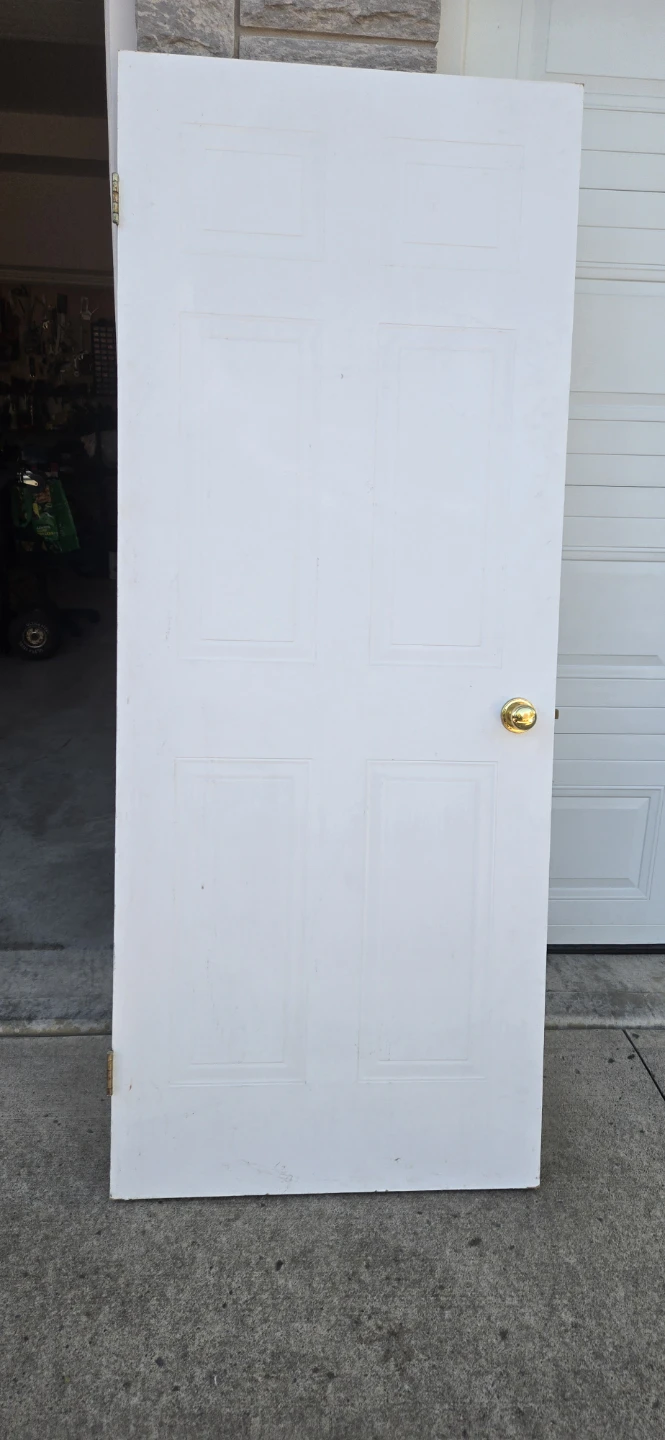 White Six-Panel Interior Door with Gold Knob
