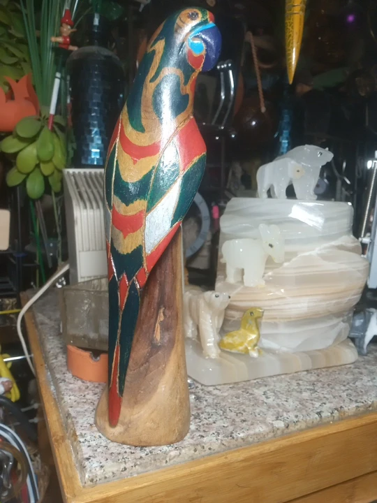 Hand-carved wooden parrot statue