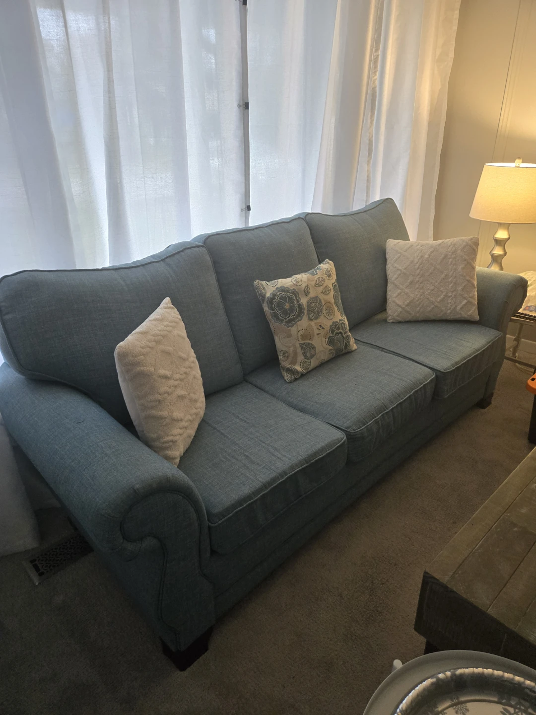 Teal Three-Seater Sofa with Decorative Pillows