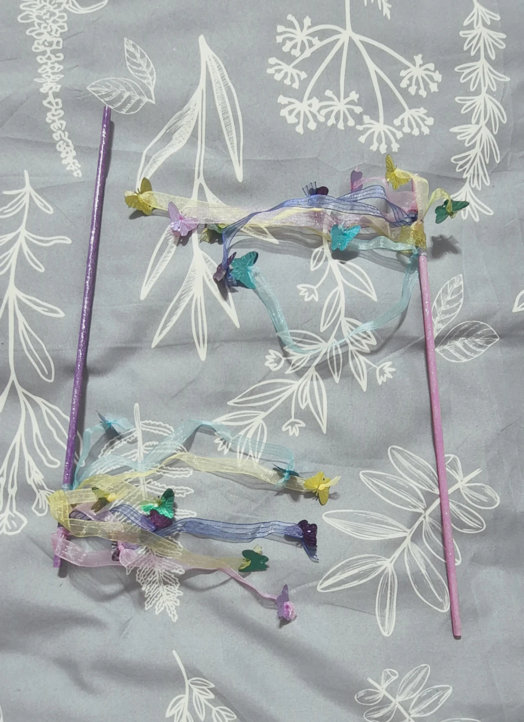 Butterfly wands with a pink or purple stem. $2 each