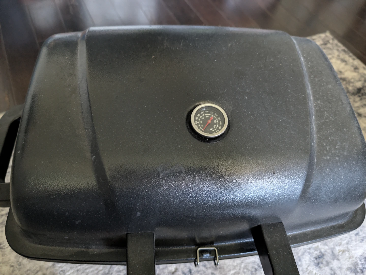 Black Portable BBQ Grill with a thermometer