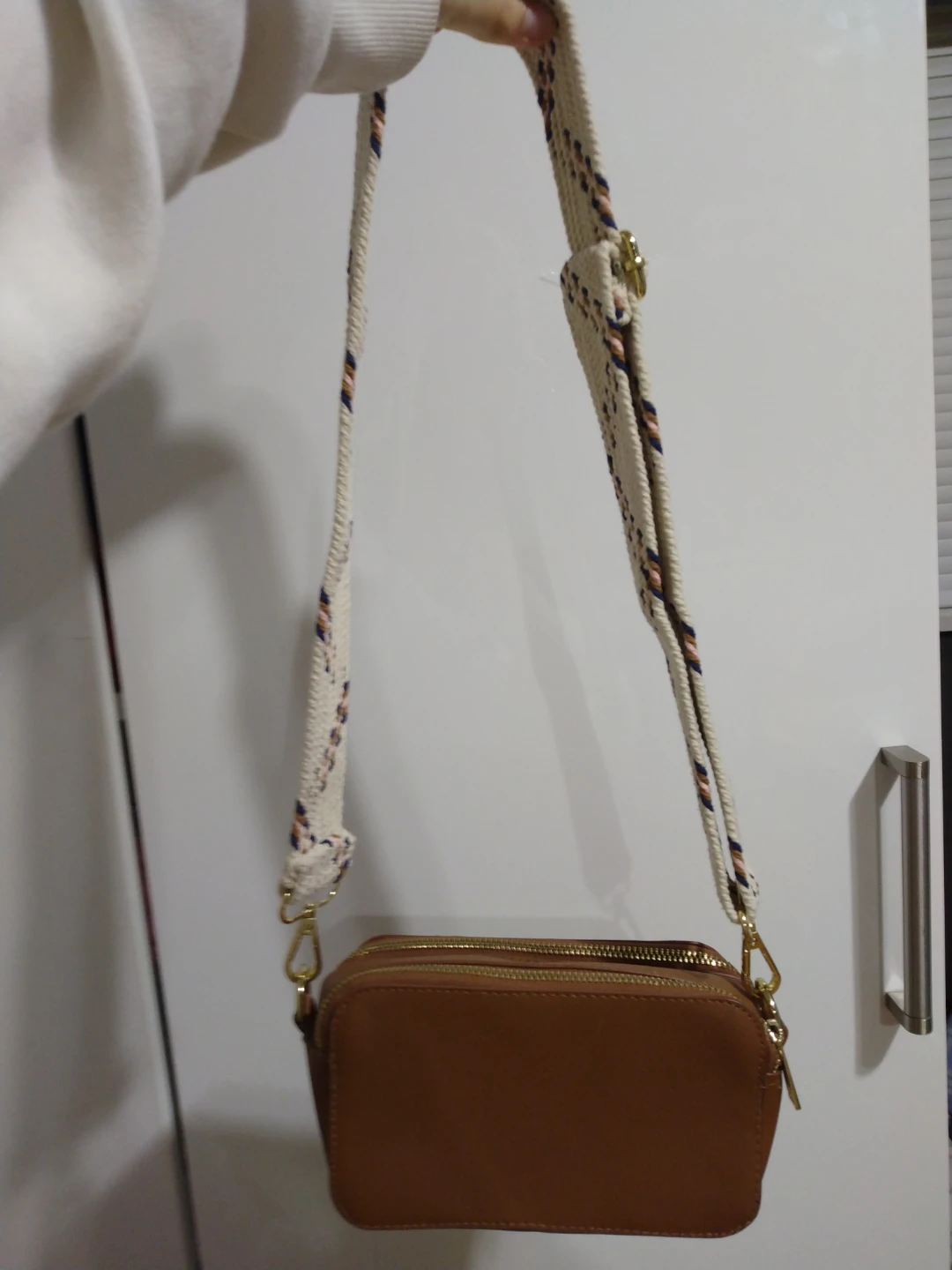 Brown crossbody bag with patterned strap