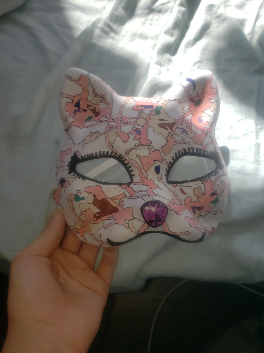Cat mask with stained designs