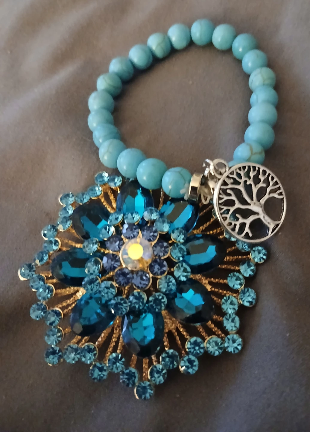 Gold-tone Flower Brooch with Blue Rhinestones
