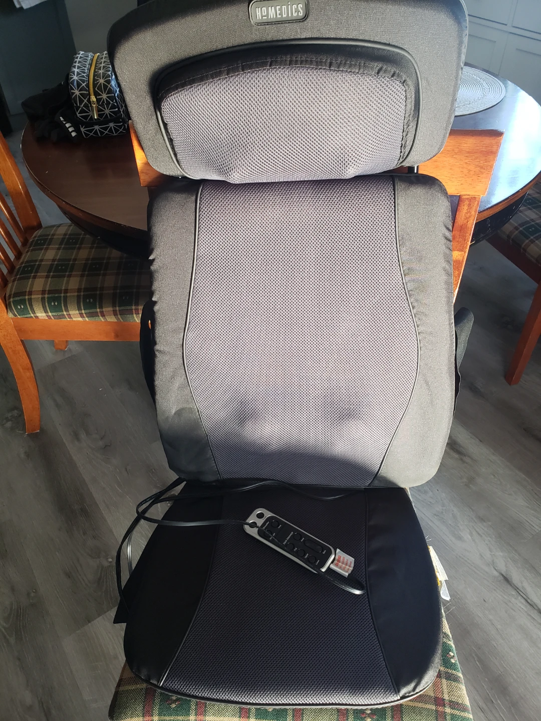 Portable heated massager for a chair.