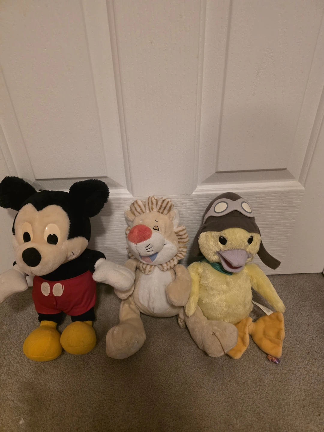 Mickey Mouse, Lion, and Duck plush toys