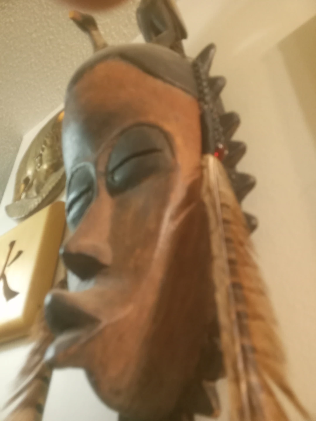 Hand Carved Wooden Mask with Feathers