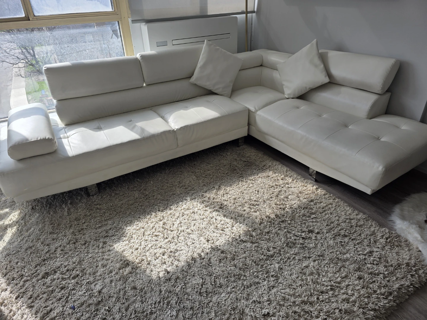 White Faux Leather Sectional Sofa with big Rug