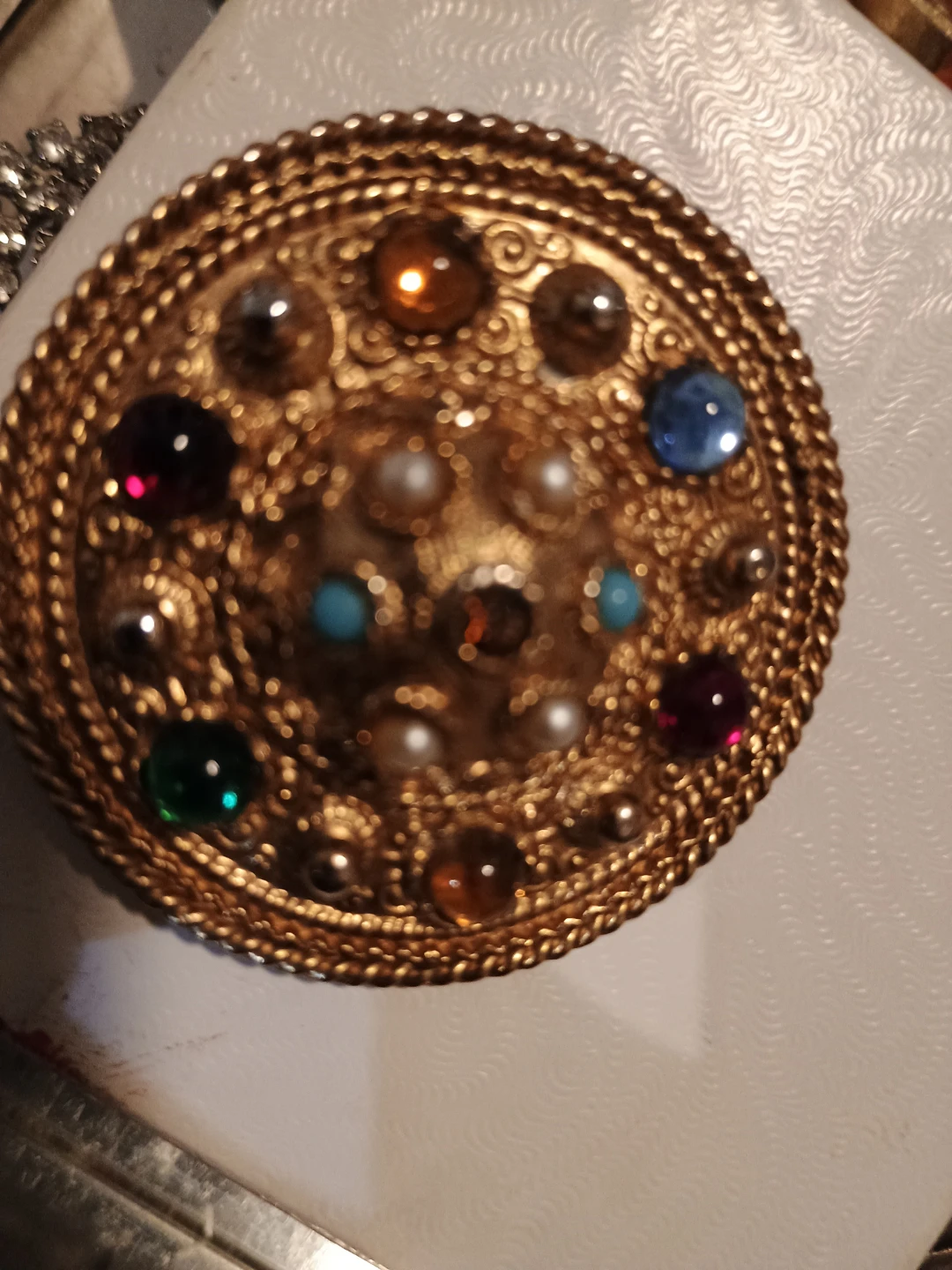 Gold tone brooch with pearl and rhinestones